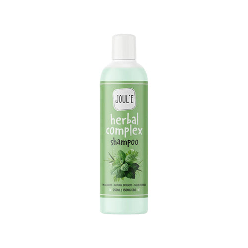 A green bottle of Joul'e 150mg CBD Salon Shampoo with a white cap. The label features images of fresh leaves and highlights key details such as the infusion of 150 mg CBD, salon-grade shampoo quality, natural extracts, and a pH-balanced formula for 250 ml.