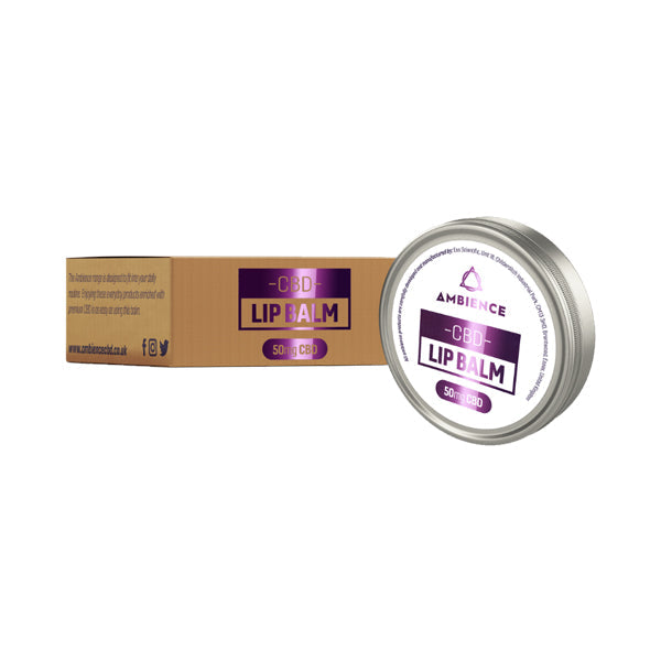 A round tin of Ambience CBD Infused 50mg CBD Lip Balm 15g (Buy 1 Get 2 Free) is placed next to its rectangular cardboard packaging. The tin features a white label with purple and black text reading 