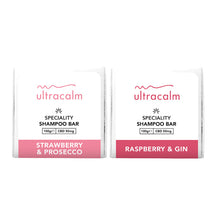 Load image into Gallery viewer, Two white packages of Ultracalm 50mg CBD Shampoo Bars. The package on the left is labeled &quot;Strawberry &amp; Prosecco&quot; with a pink band at the bottom, and the one on the right is labeled &quot;Raspberry &amp; Gin&quot; with a red band at the bottom. Each bar, infused with natural essential oils, contains 50mg of CBD and weighs 100g.
