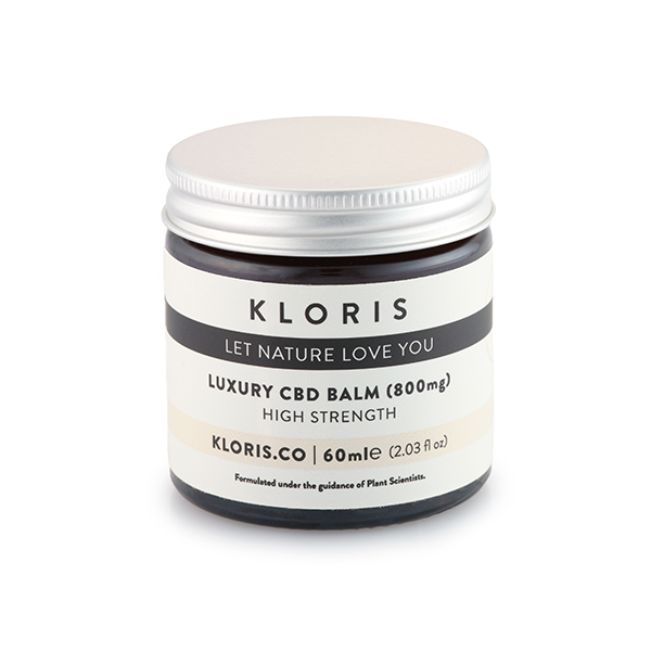 A 60ml dark brown jar of Kloris 800mg Luxury CBD Balm with a silver lid. The label reads 