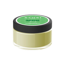 Load image into Gallery viewer, A small, round, clear container with a black lid, labeled &quot;Sensi CBD&quot; in white text on a green background. This natural vegan-friendly container holds 100mg of Sensi CBD Massage Wax—a light green, creamy product designed for therapeutic relief.
