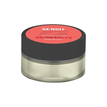 Load image into Gallery viewer, A small, cylindrical container with a black lid and a clear body holds a vegan-friendly, CBD-infused lip balm. The label on the lid is red and reads &quot;Sensi Skin 100mg CBD Lip Balm - Strawberry.&quot; The net weight is listed as 25ml, and it comes with a BUY 1 GET 1 FREE offer.
